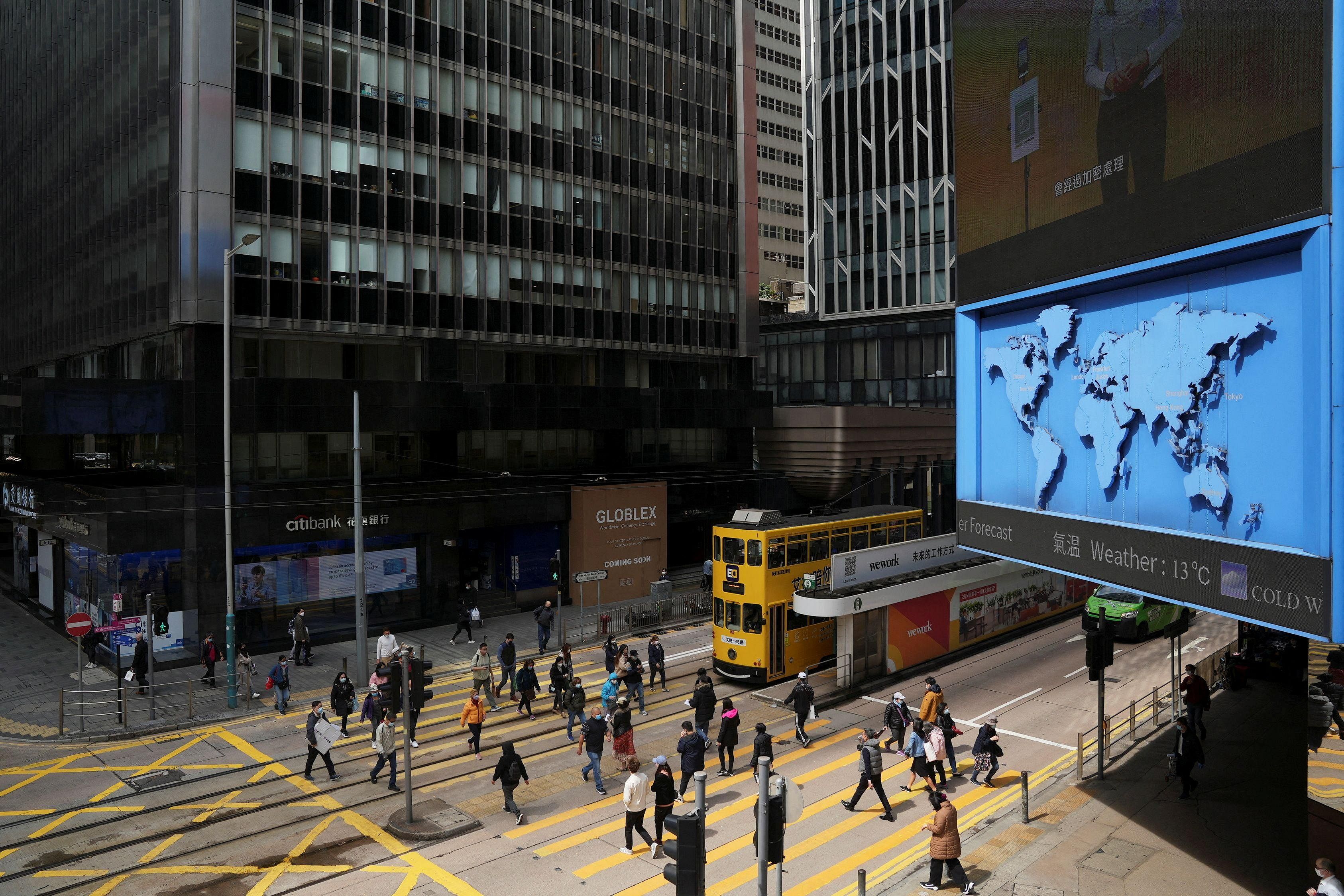 Hong Kong Budget Expected to Ease Property Curbs, Boost Tourism to