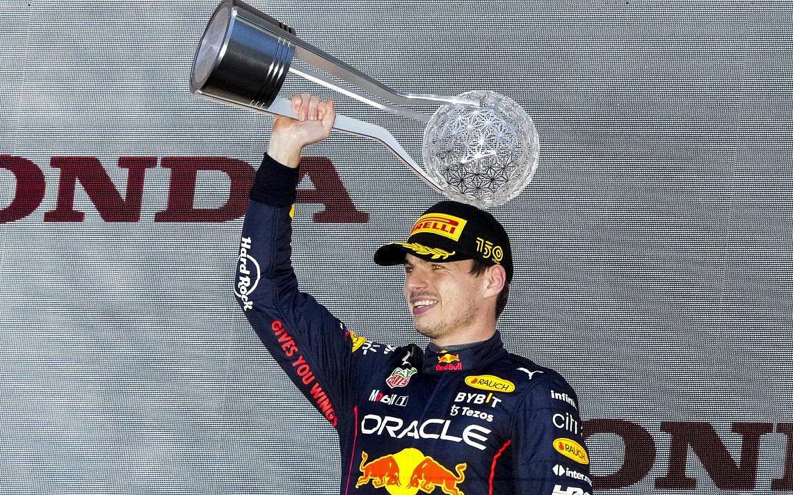 Verstappen wins chaotic, rain-shortened Japanese GP to clinch title