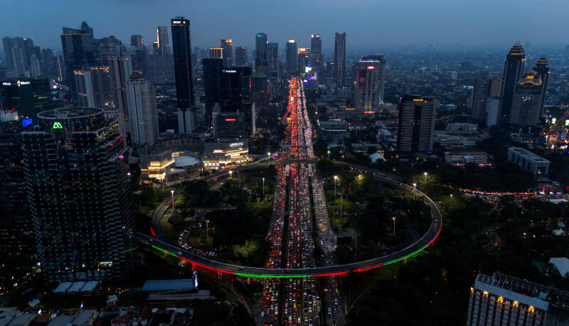 Jakarta’s glowing skyline during the evening commute.