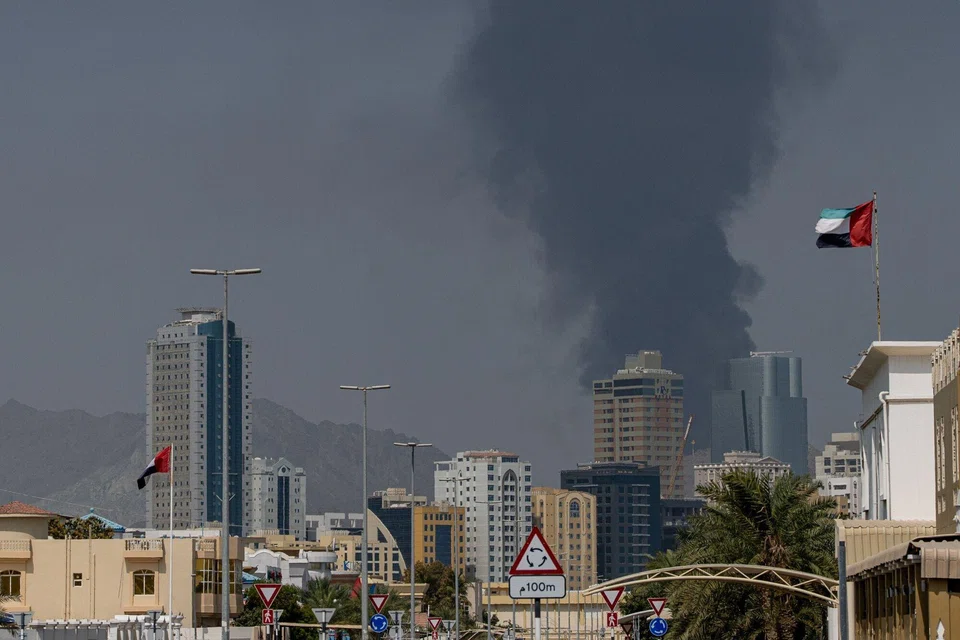 Smoke rising after an explosion due to drone debris in the industrial zone in Fujairah, United Arab Emirates, on Mar 3. Security and safety precautions are the topmost priority for South-east Asian companies with teams in the region. PHOTO: BLOOMBERG
