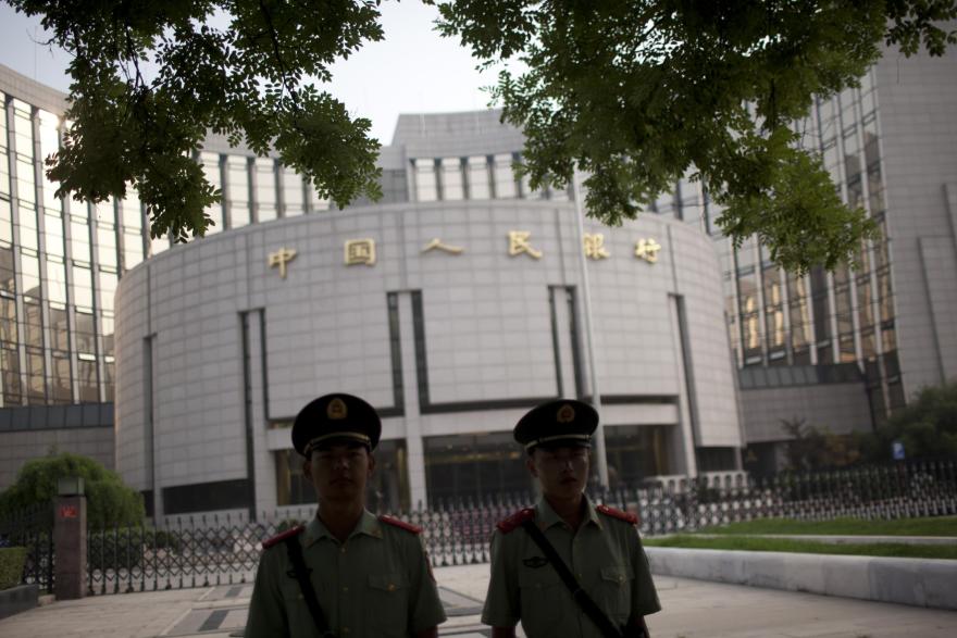 China set to bide time on rate cut until yuan, data stabilise