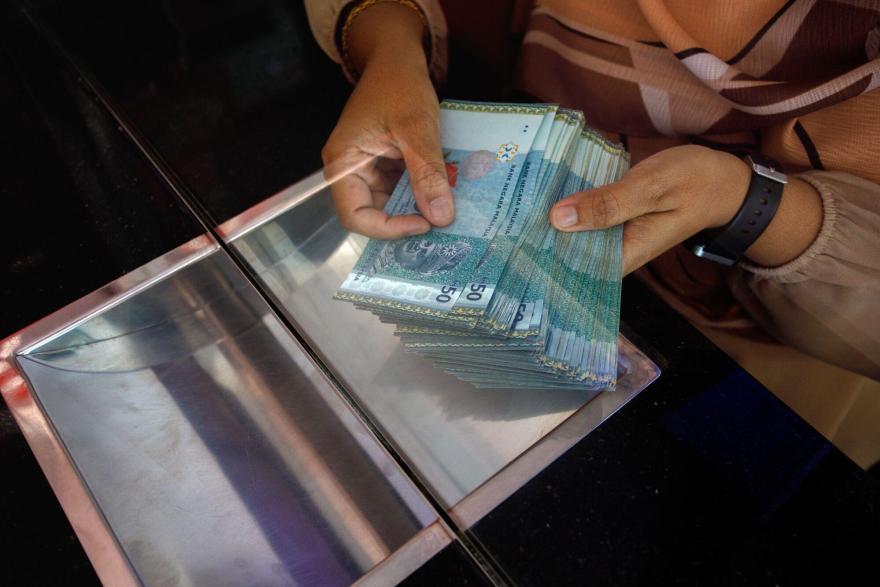 Malaysian ringgit within a whisker of its 1998 record low