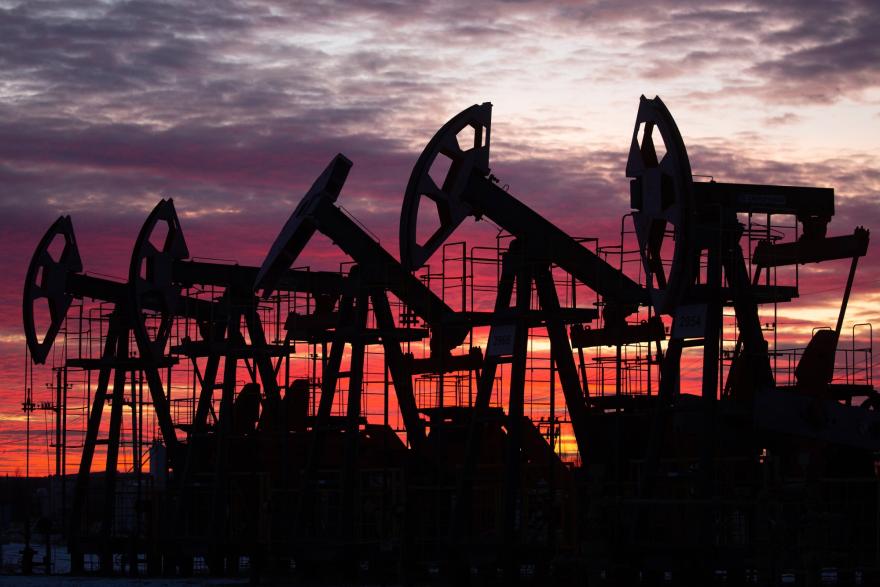 Oil prices settle slightly down after US boosts crude output forecast Oil prices settle slightly down after US boosts crude output forecast