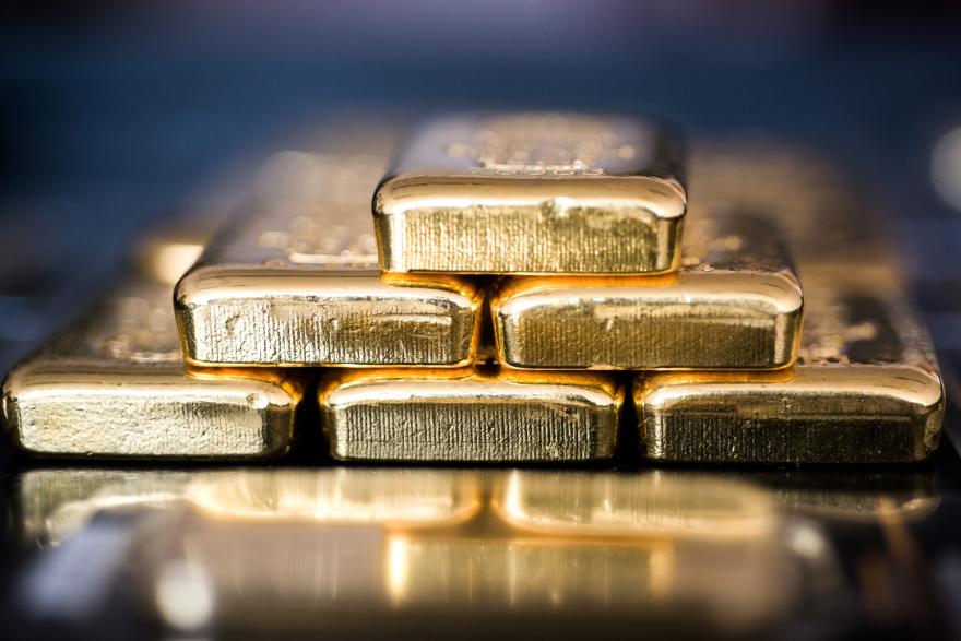 Gold hits record high as US Fed sticks to three rate cuts in 2024